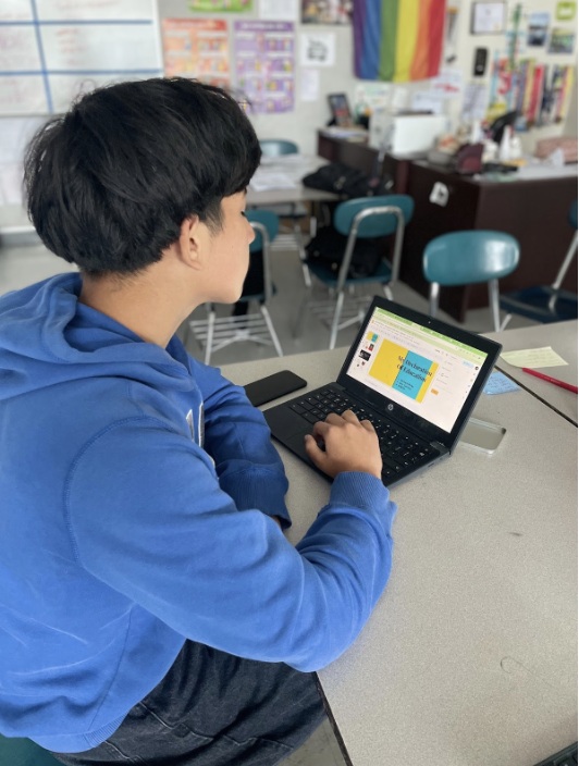 Student Richard R. working on his defense slides
