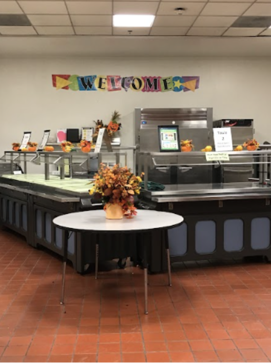 A picture of the inside of the cafeteria. 
