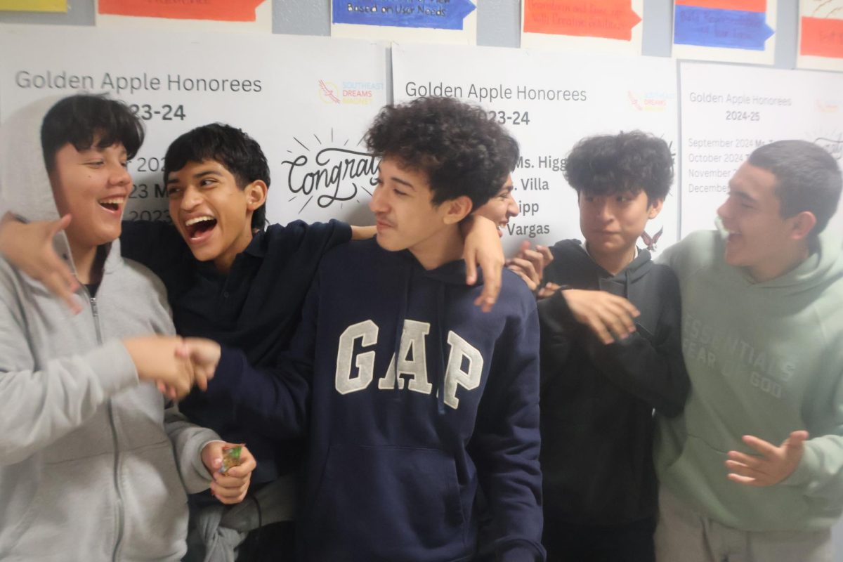 Kids posing to show their excited to be back at school.