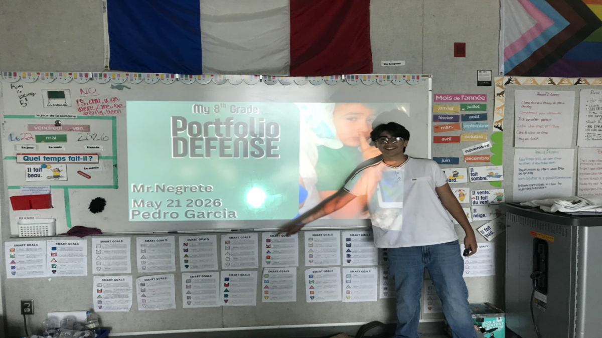 8th grader Pedro Garcia Sanchez doing his portfolio.